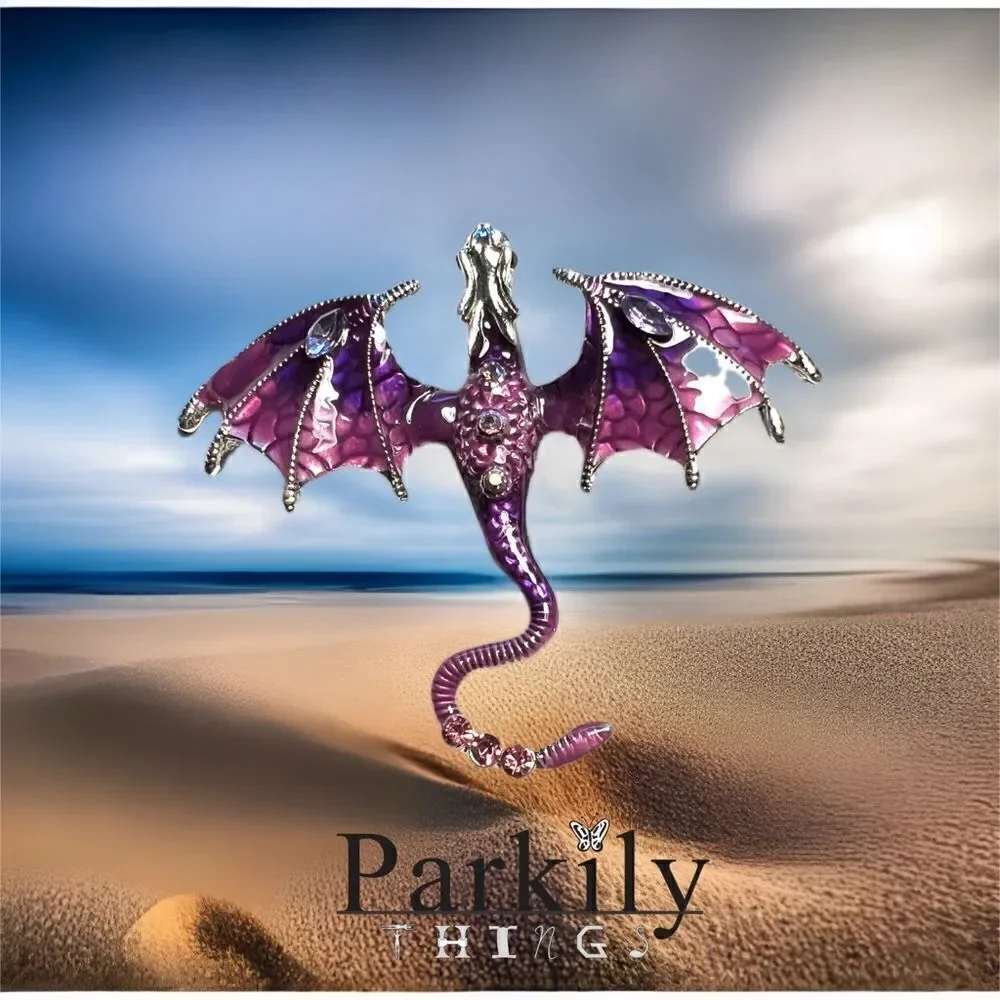 Brooch dragon in purple adorned with sparkly crystals on a silver pin